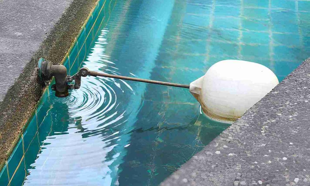 Pool remodeling Hobe Sound float valve system with turquoise tile tank regulating water level